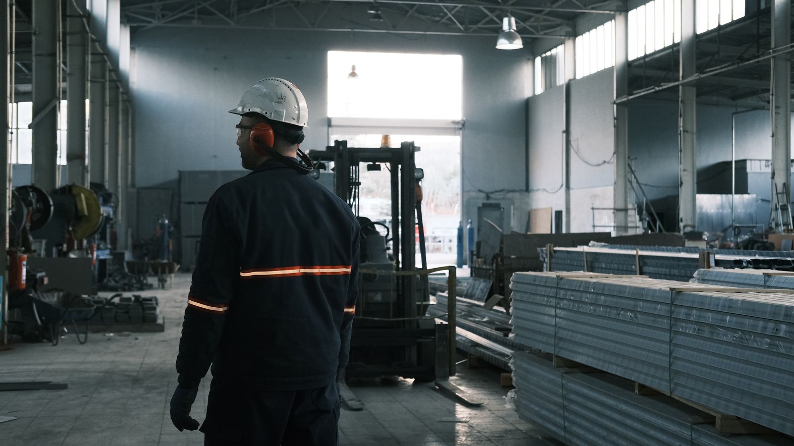 Industrial professional overseeing a modern factory
