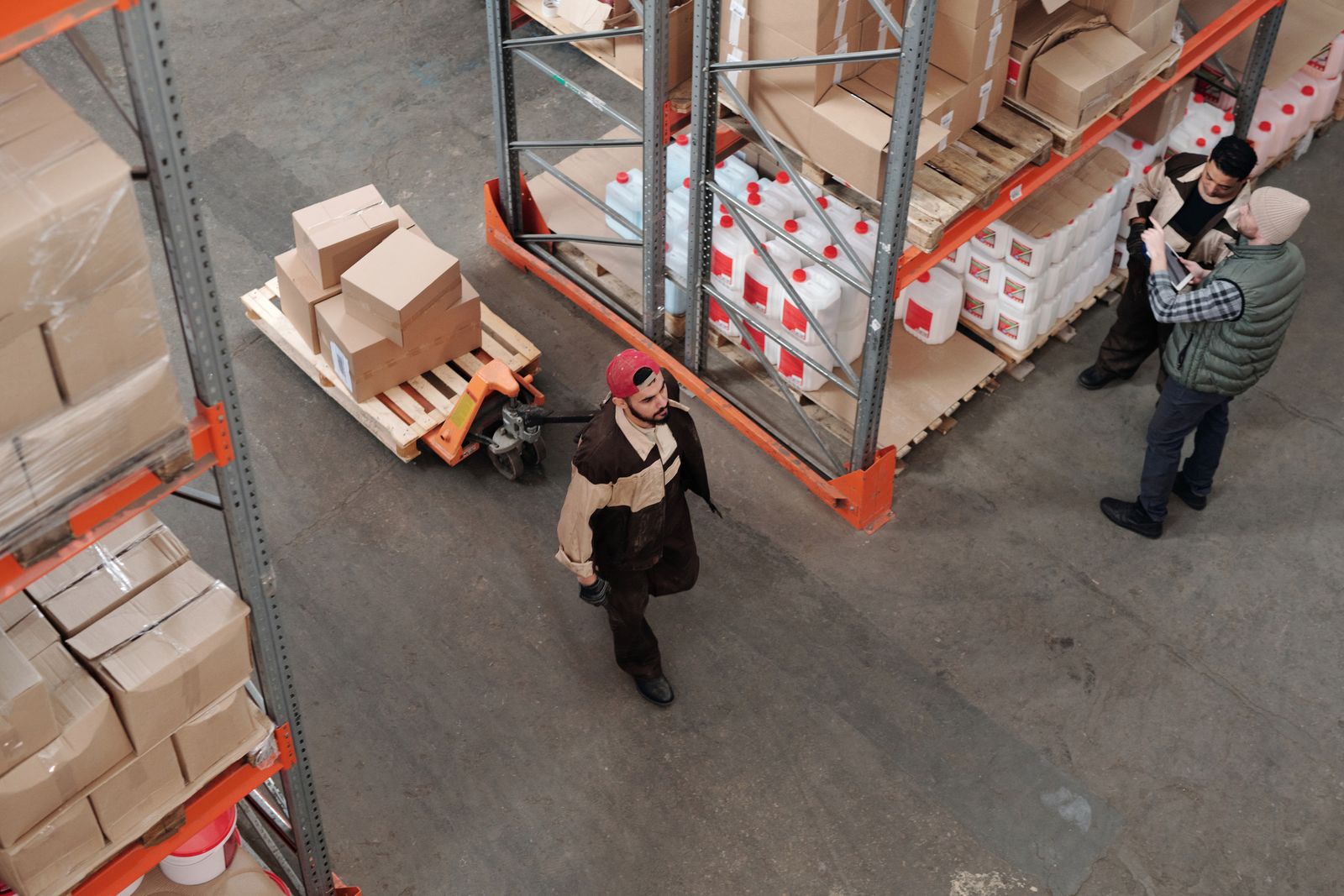 Professionals collaborating in a warehouse